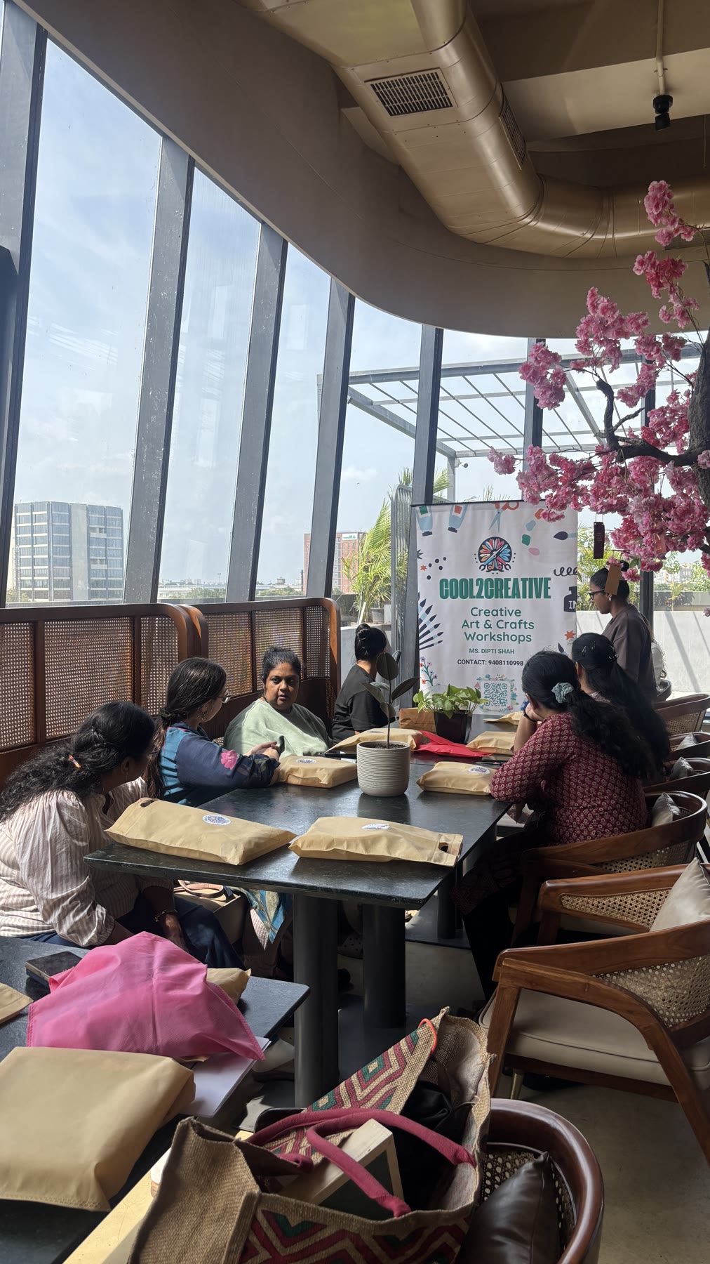 Guests gathered around a table at a Cool2Creative workshop